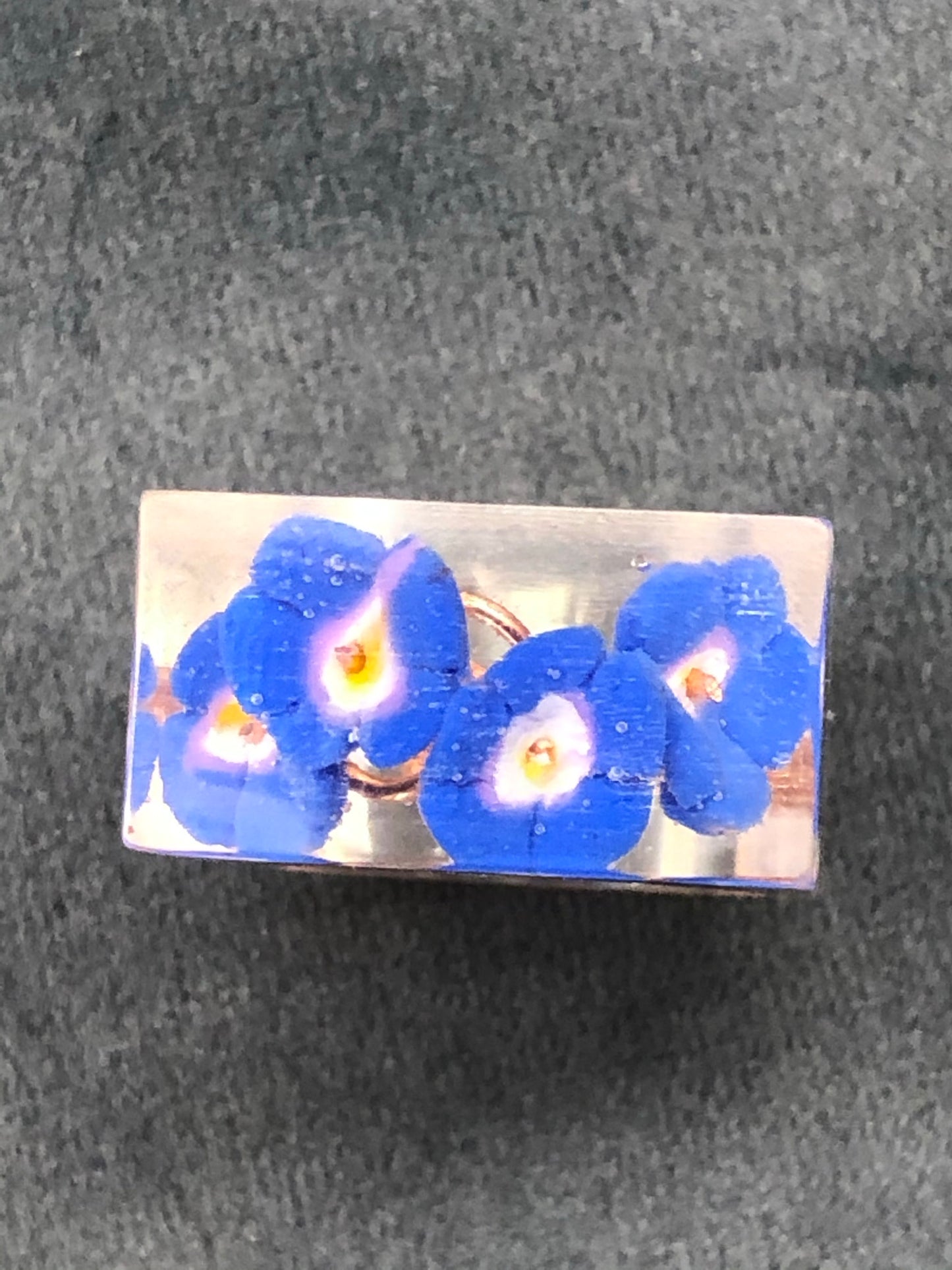 Forget me not Ring, is a handmade crystal clear epoxy resin ring with Forget me not Ring, is a handmade crystal clear epoxy resin ring with hand sculpted polymer clay forget me not flowers encased inside. Part of Padpod & Berries Wresin ringPadpod & BerrieMy Fairytale Giftshandmade crystal clear epoxy resin ring