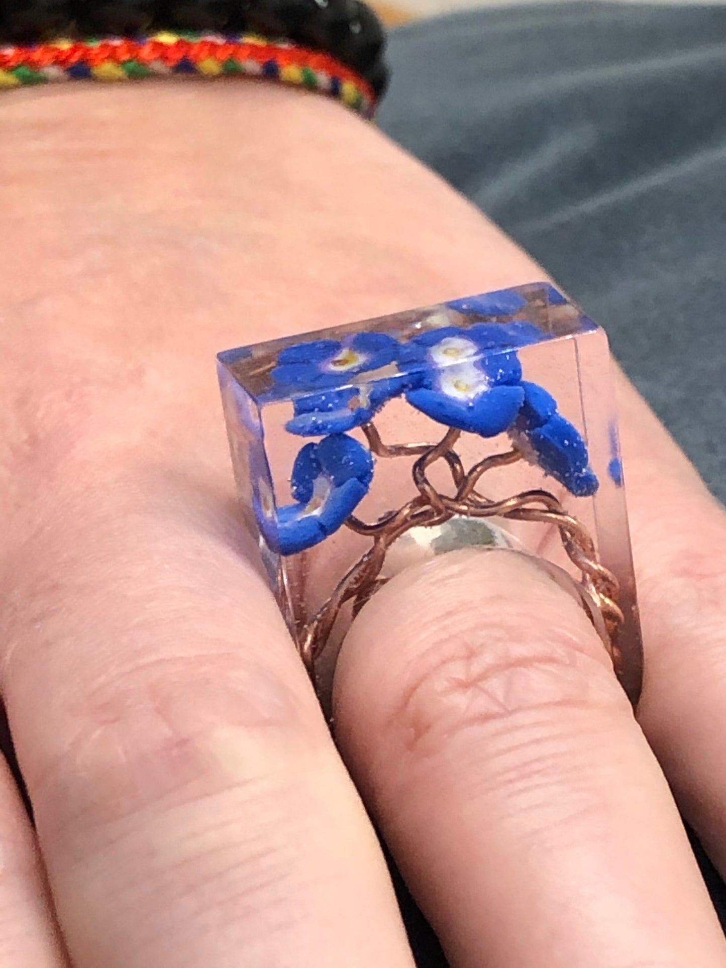 Forget me not Ring, is a handmade crystal clear epoxy resin ring with Forget me not Ring, is a handmade crystal clear epoxy resin ring with hand sculpted polymer clay forget me not flowers encased inside. Part of Padpod & Berries Wresin ringPadpod & BerrieMy Fairytale Giftshandmade crystal clear epoxy resin ring