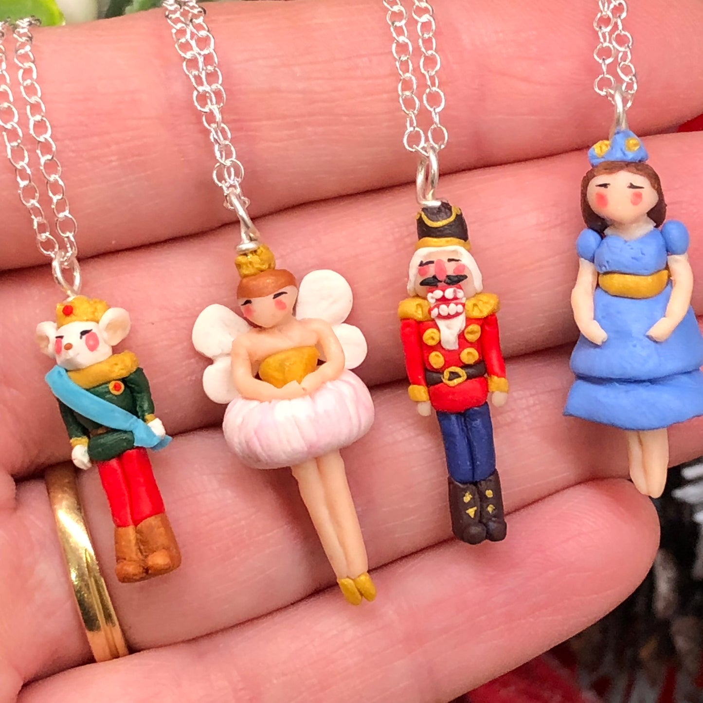 The Nutcracker Necklace from The Nutcracker CollectionIntroducing our enchanting Nutcracker Necklace, meticulously hand made in polymer clay on a 925 sterling silver bail and pin base. Inspired by the iconic character fnecklacePadpod & BerrieMy Fairytale GiftsNutcracker Necklace