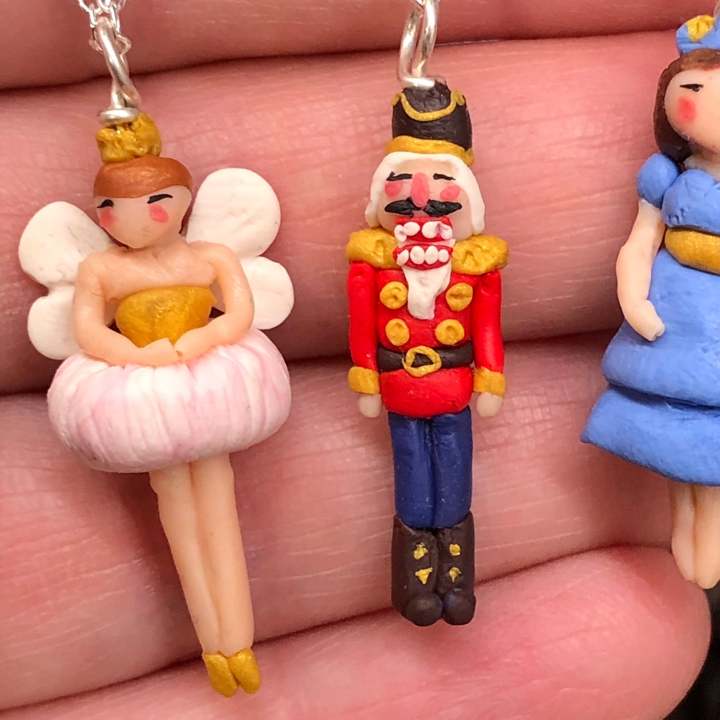 The Nutcracker Necklace from The Nutcracker CollectionIntroducing our enchanting Nutcracker Necklace, meticulously hand made in polymer clay on a 925 sterling silver bail and pin base. Inspired by the iconic character fnecklacePadpod & BerrieMy Fairytale GiftsNutcracker Necklace