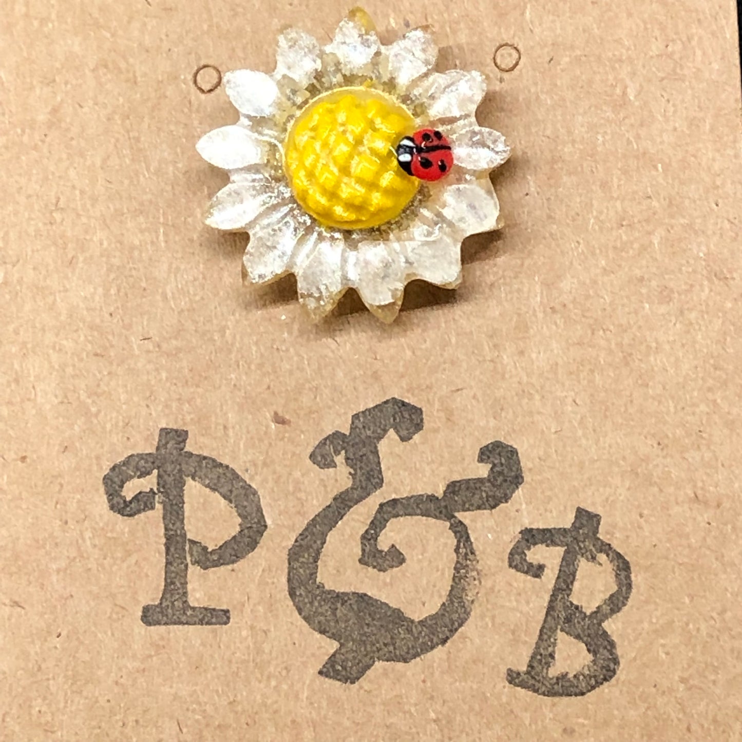 Daisy Flower lapel pin with miniature polymer clay ladybird handmade t
Introducing our enchanting Handmade Daisy flower with miniature polymer clay ladybird lapel pin - the perfect accessory to add a touch of whimsy to any outfit! 🌼?apel pinPadpod & BerrieMy Fairytale Giftsminiature polymer clay ladybird handmade