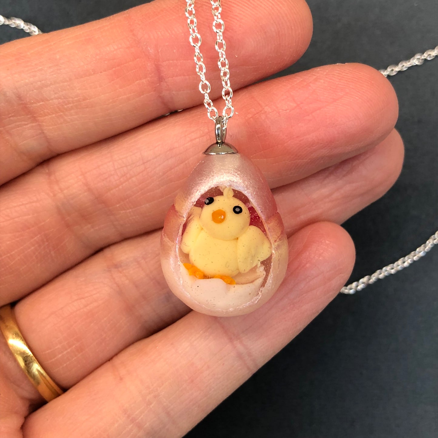 my hand sculpted polymer clay chick Secret Egg necklace Ooak jewellery, my hand sculpted polymer clay chick inside hand poured epoxy resin egg which is made from my handmade silicone mold. Secret Egg nnecklacePadpodandberrieMy Fairytale Giftshand sculpted polymer clay chick inside hand poured epoxy resin egg