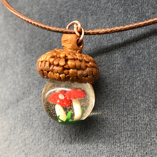 Acorn Necklace, handmade polymer clay acorn cap and tiny mushrooms insAcorn Necklace, handmade polymer clay acorn cap and tiny mushrooms inside crystal clear epoxy resin Pendant on waxed cotton thong necklace with lobster claw fastenernecklacePadpod & BerrieMy Fairytale GiftsAcorn Necklace, handmade polymer clay acorn cap