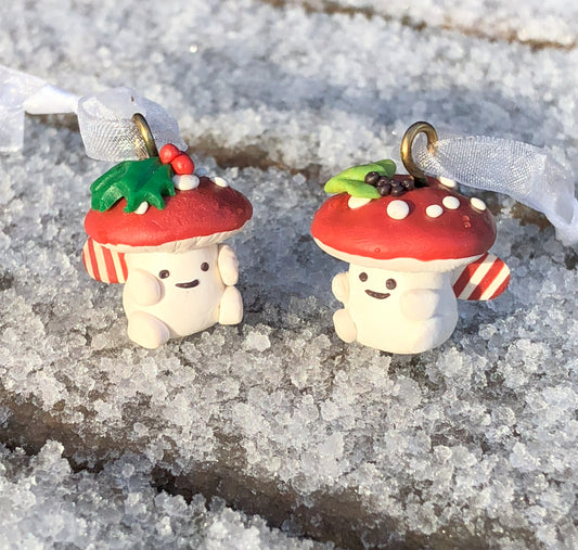 Introducing our Holly & Ivy cute candy cane winged Mushroom charms handmade in polymer clay, to dangle as home decor or thread on a cord to wear as a necklace