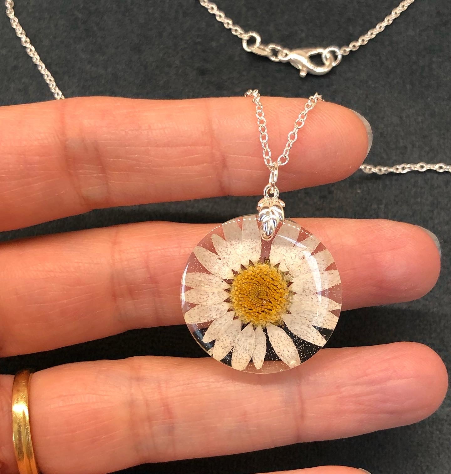 Daisy in epoxy resin necklace on 925 silver plated 18” chain with lobster claw fastener.Handmade  in Grimsby, England, United Kingdom.necklacePadpodandberrieMy Fairytale Gifts925 silver plated 18” chain