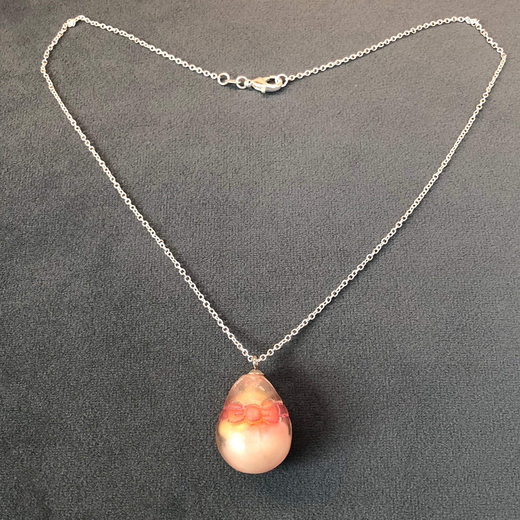 my hand sculpted polymer clay chick Secret Egg necklace Ooak jewellery, my hand sculpted polymer clay chick inside hand poured epoxy resin egg which is made from my handmade silicone mold. Secret Egg nnecklacePadpodandberrieMy Fairytale Giftshand sculpted polymer clay chick inside hand poured epoxy resin egg
