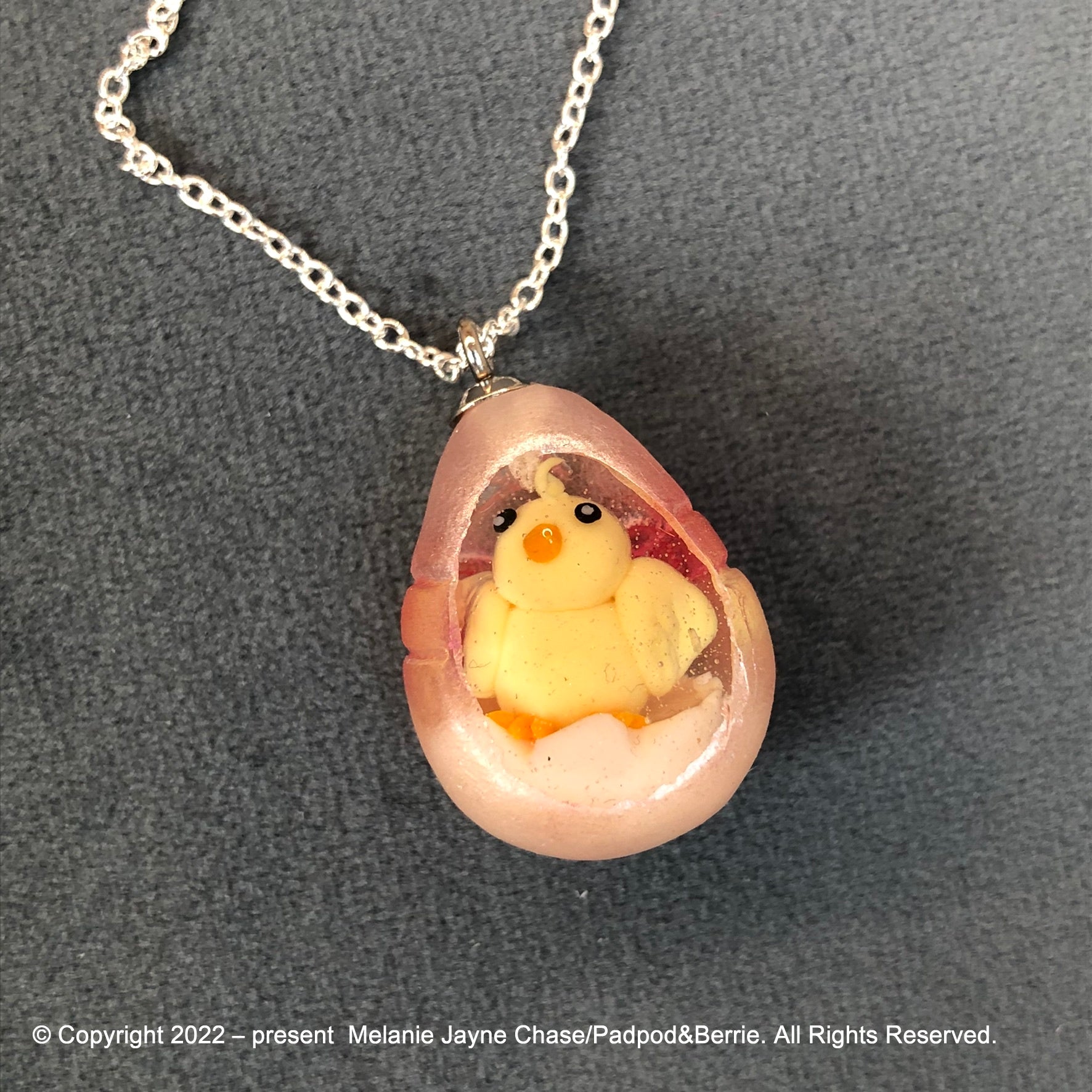 my hand sculpted polymer clay chick Secret Egg necklace Ooak jewellery, my hand sculpted polymer clay chick inside hand poured epoxy resin egg which is made from my handmade silicone mold. Secret Egg nnecklacePadpodandberrieMy Fairytale Giftshand sculpted polymer clay chick inside hand poured epoxy resin egg